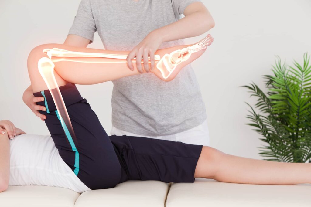 A woman receives Chiropractic treatment.